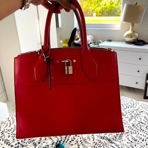LV red bag , perfect condition.